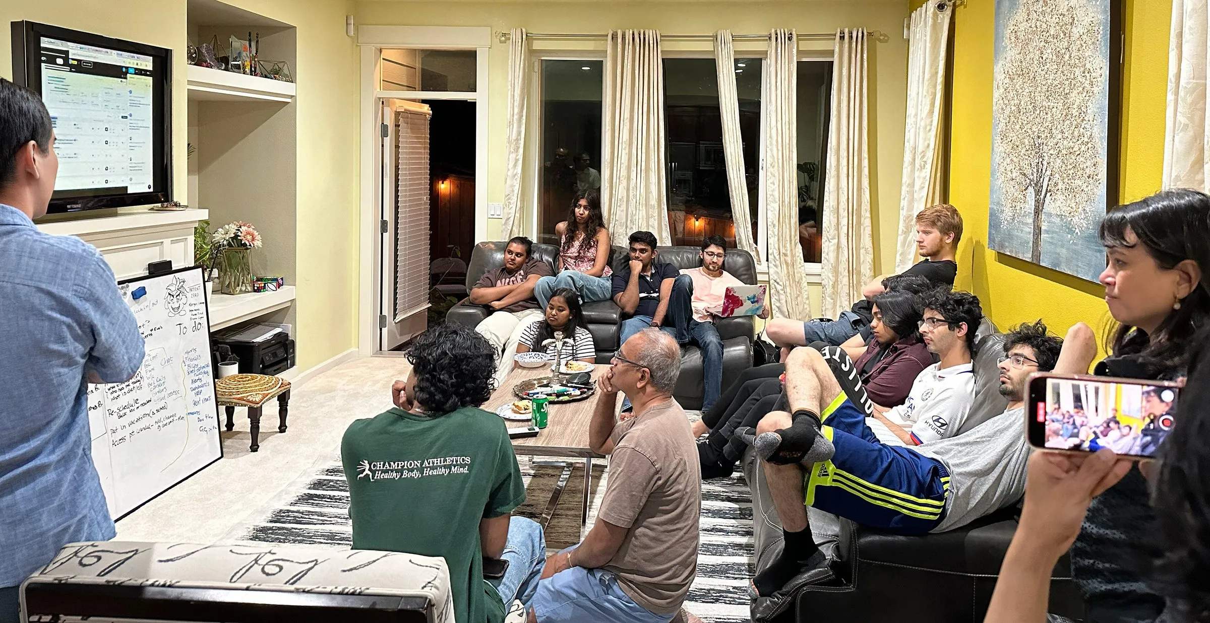A CareDocs.ai working session, the team gathered around a whiteboard